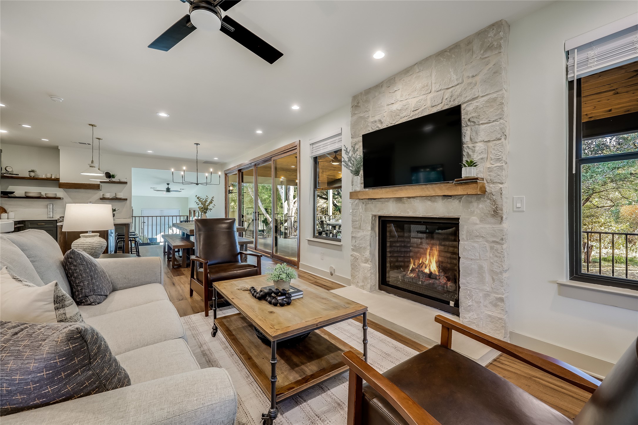 7601 Bar K Ranch Road Lago Vista, TX 78645 - Photo 9 of 38 Living room with a stone fireplace