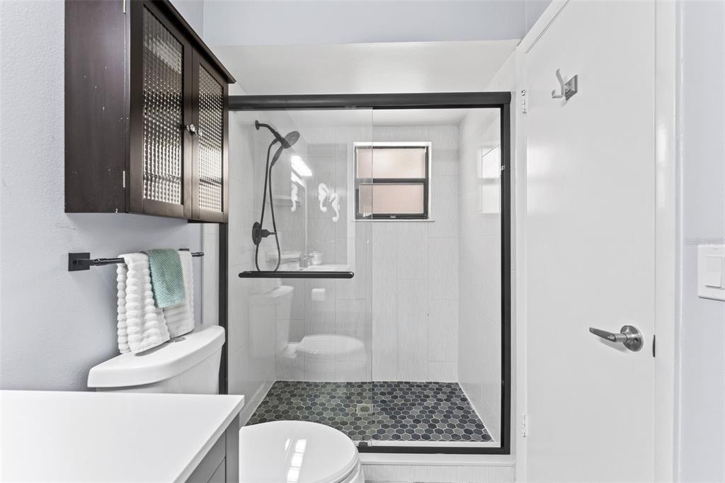 29 Pelican Lane Edgewater, FL 32141 - Photo 16 of 39 a bathroom with a toilet sink and shower