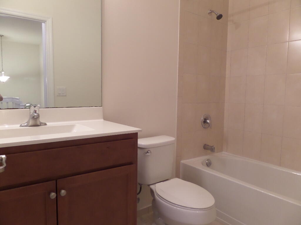 9328 West 33rd Way Hialeah, FL 33018 - Photo 18 of 24 a bathroom with a sink a toilet and bathtub