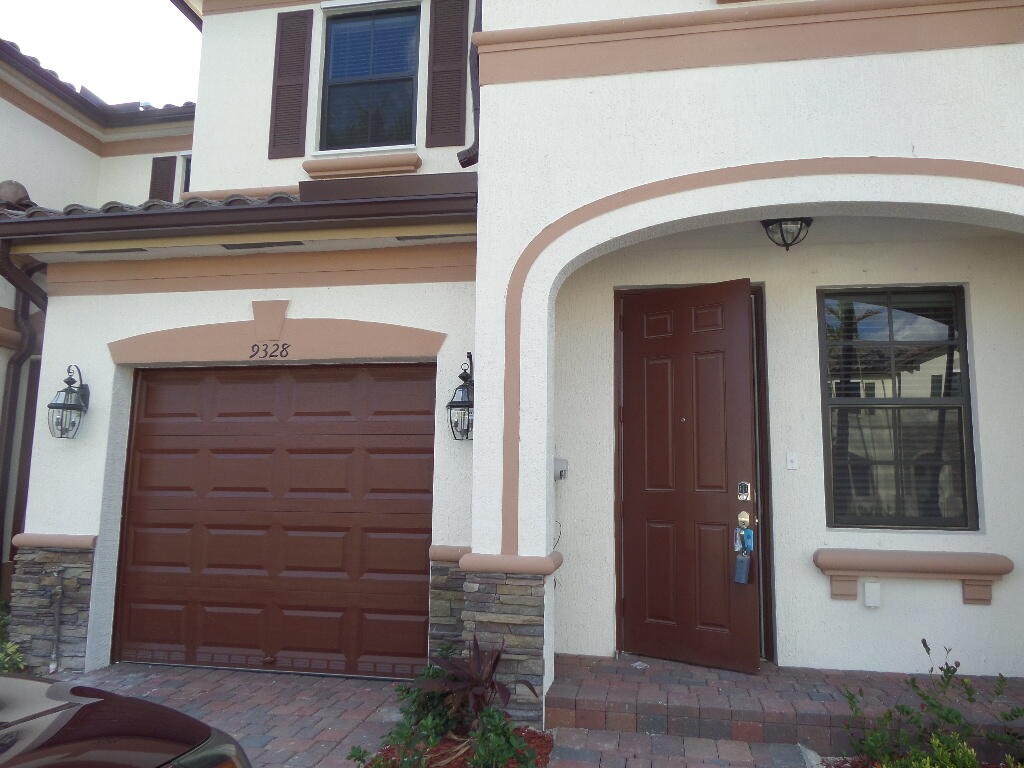 9328 West 33rd Way Hialeah, FL 33018 - Photo 2 of 24 a front view of a house