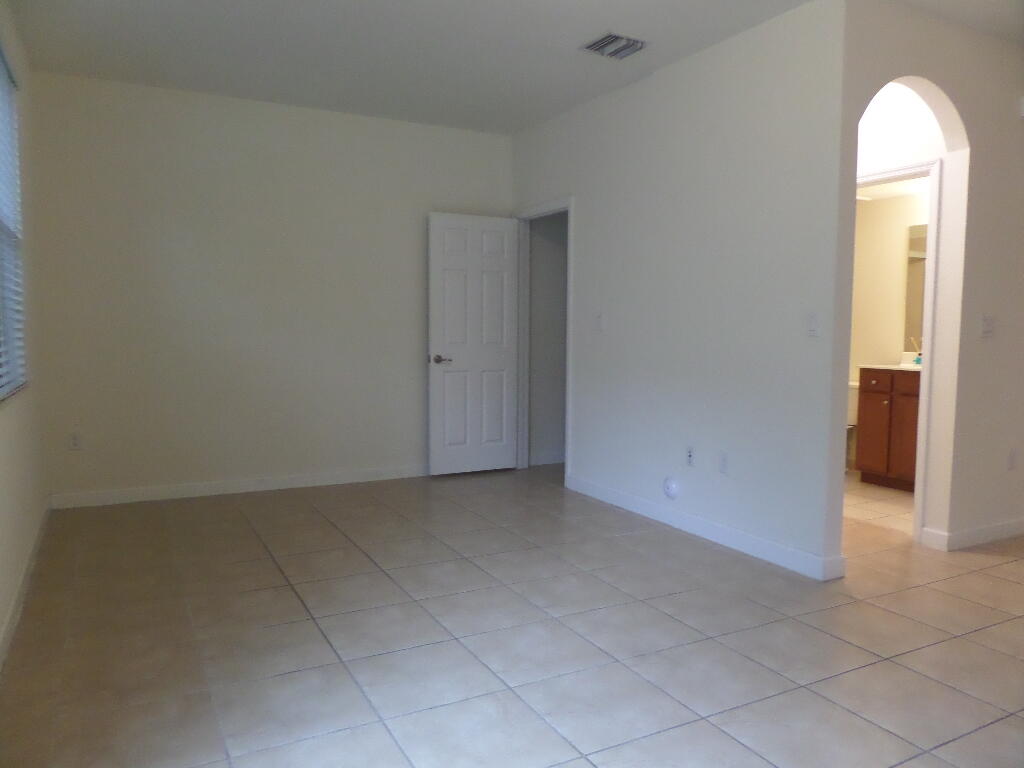 9328 West 33rd Way Hialeah, FL 33018 - Photo 8 of 24 an empty room with window