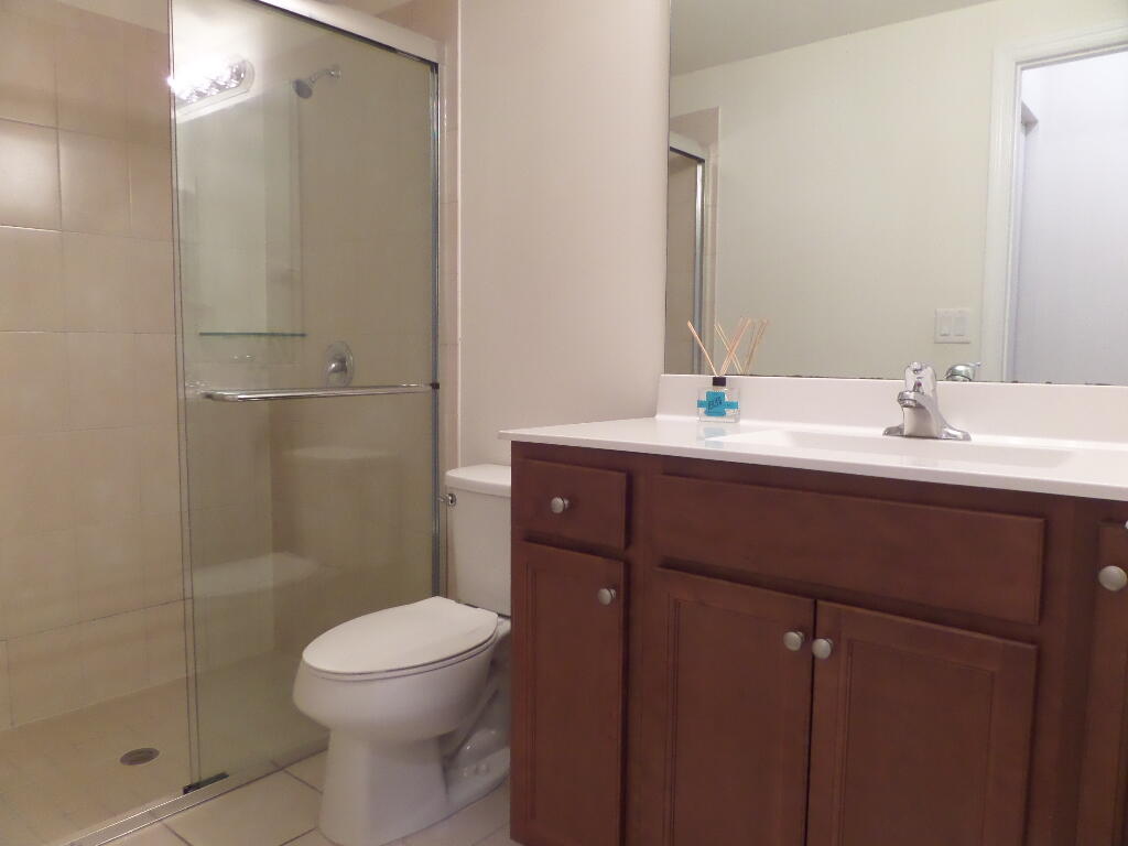 9328 West 33rd Way Hialeah, FL 33018 - Photo 9 of 24 a bathroom with a sink a toilet and shower