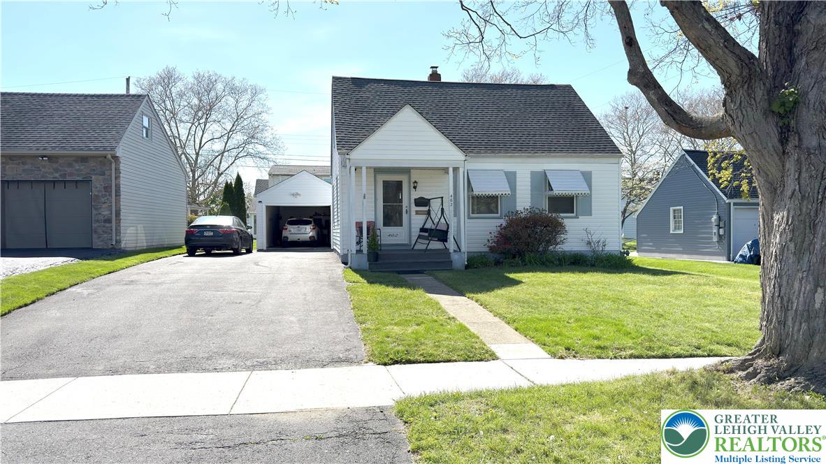 462 Maple Road Hellertown, PA 18055 - Photo 1 of 25 a front view of a house with garden