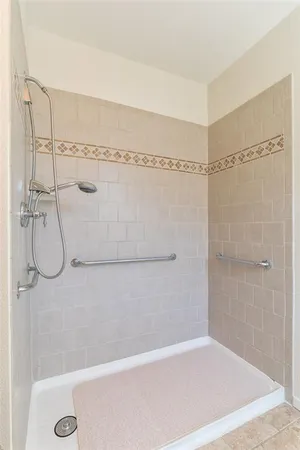 a view of a patio with a table and chairs