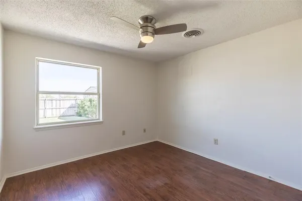a view of a house with a backyard and sitting area