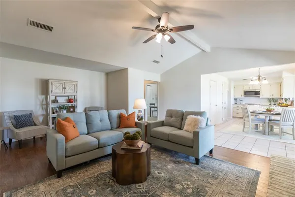 a kitchen with a dining table and chairs