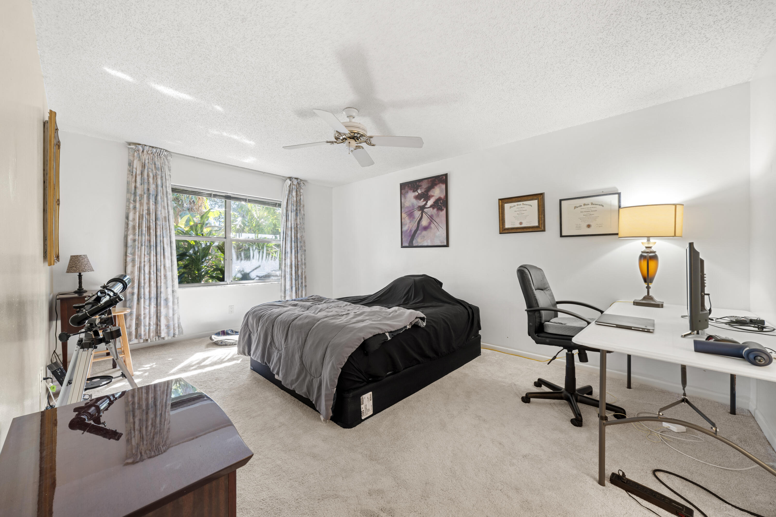 197 Bent Arrow Drive Jupiter, FL 33458 - Photo 15 of 33 a living room with a bed furniture and a window