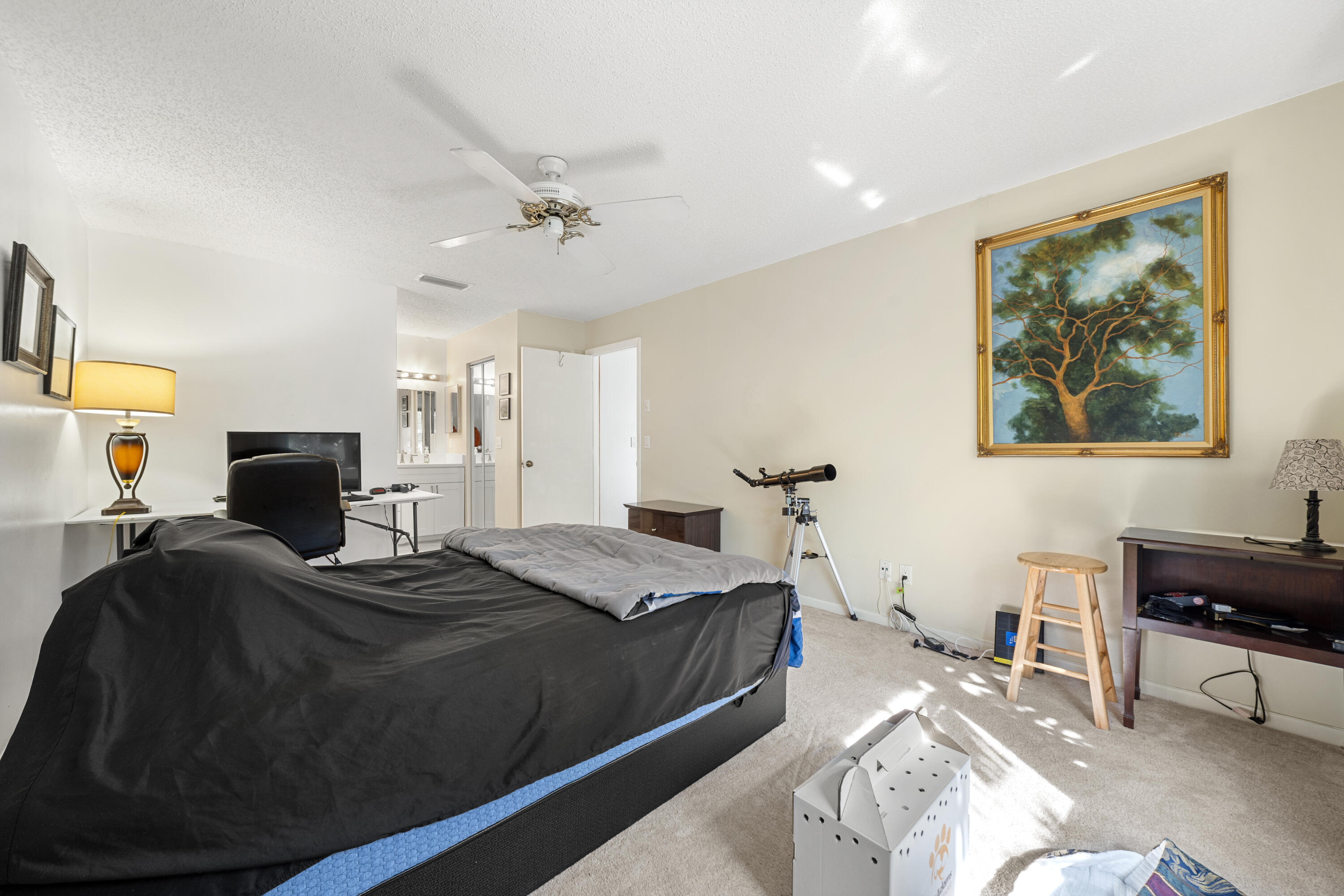 197 Bent Arrow Drive Jupiter, FL 33458 - Photo 16 of 33 a bedroom that has a bed and a chair in it