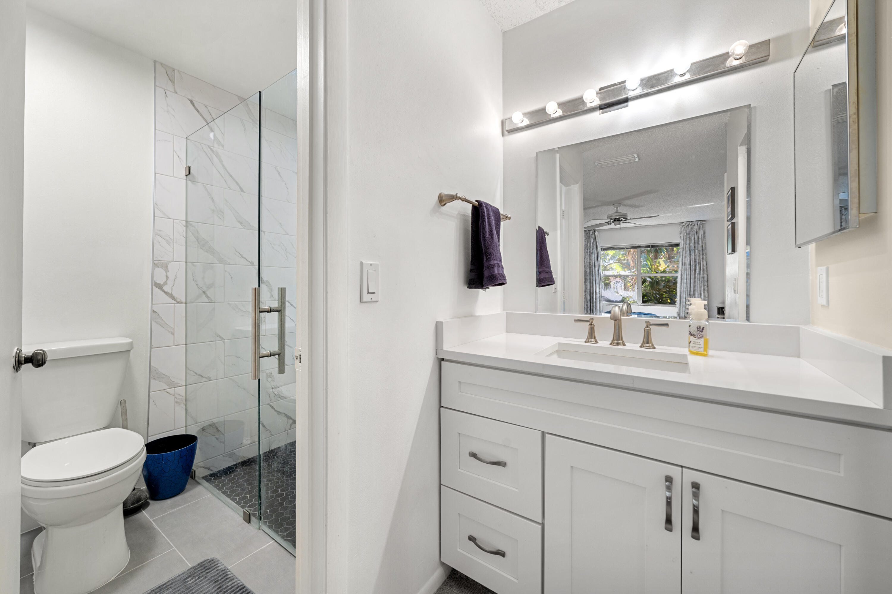 197 Bent Arrow Drive Jupiter, FL 33458 - Photo 17 of 33 a bathroom with a sink a toilet and shower