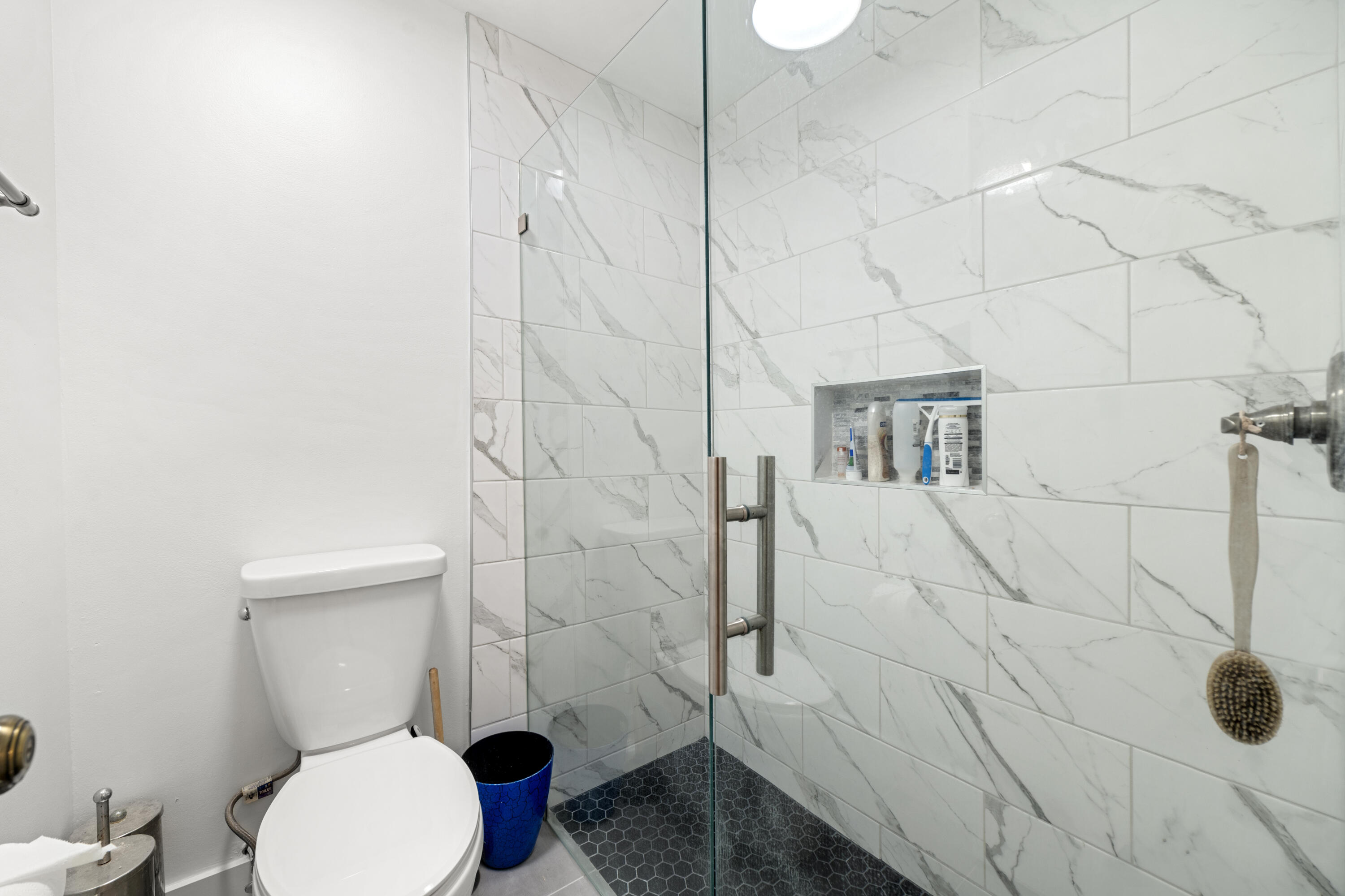 197 Bent Arrow Drive Jupiter, FL 33458 - Photo 18 of 33 a bathroom with a toilet and a shower