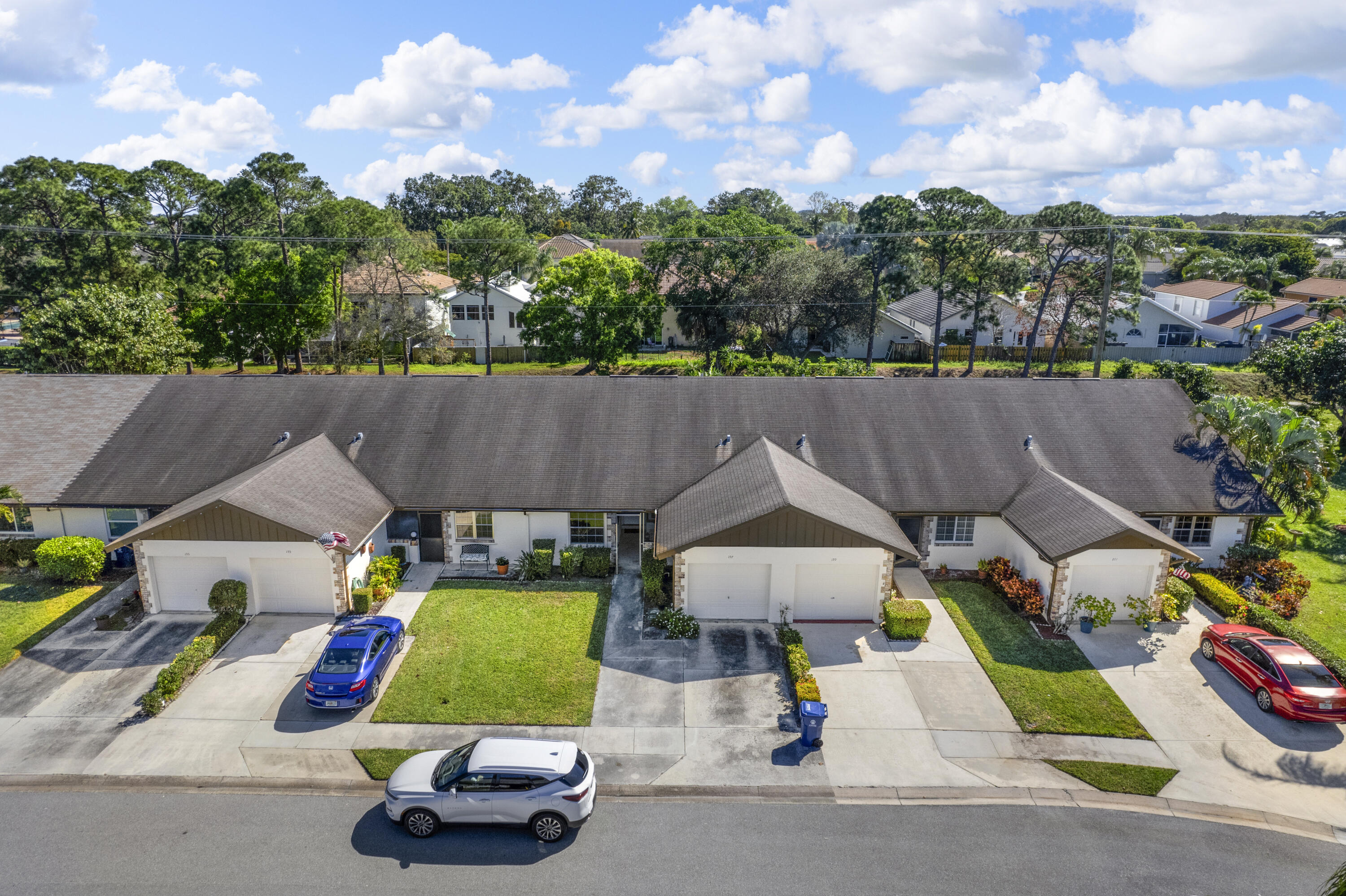197 Bent Arrow Drive Jupiter, FL 33458 - Photo 2 of 33 an aerial view of a house with garden space and street view