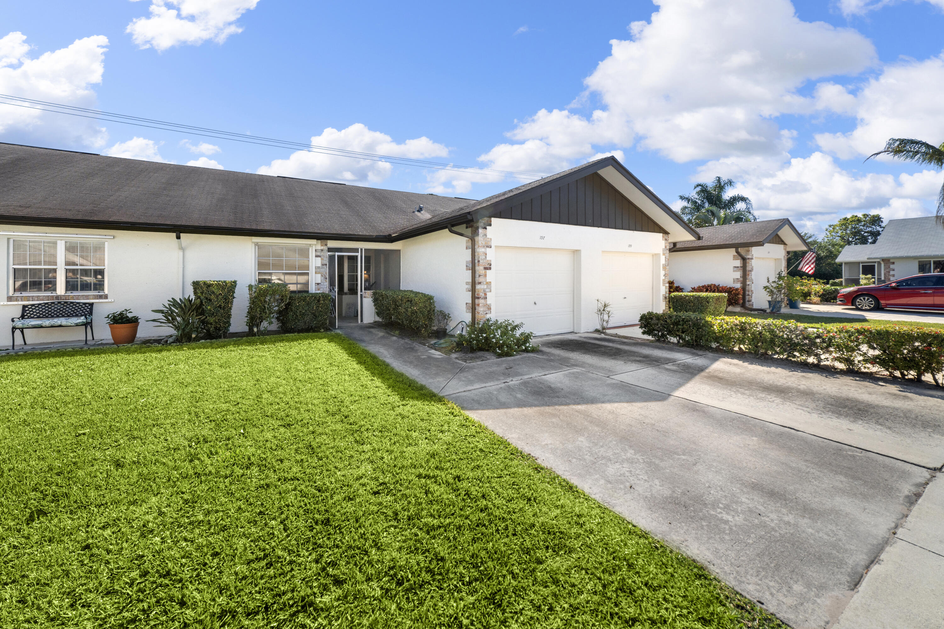 197 Bent Arrow Drive Jupiter, FL 33458 - Photo 23 of 33 a view of a house with a yard and garage