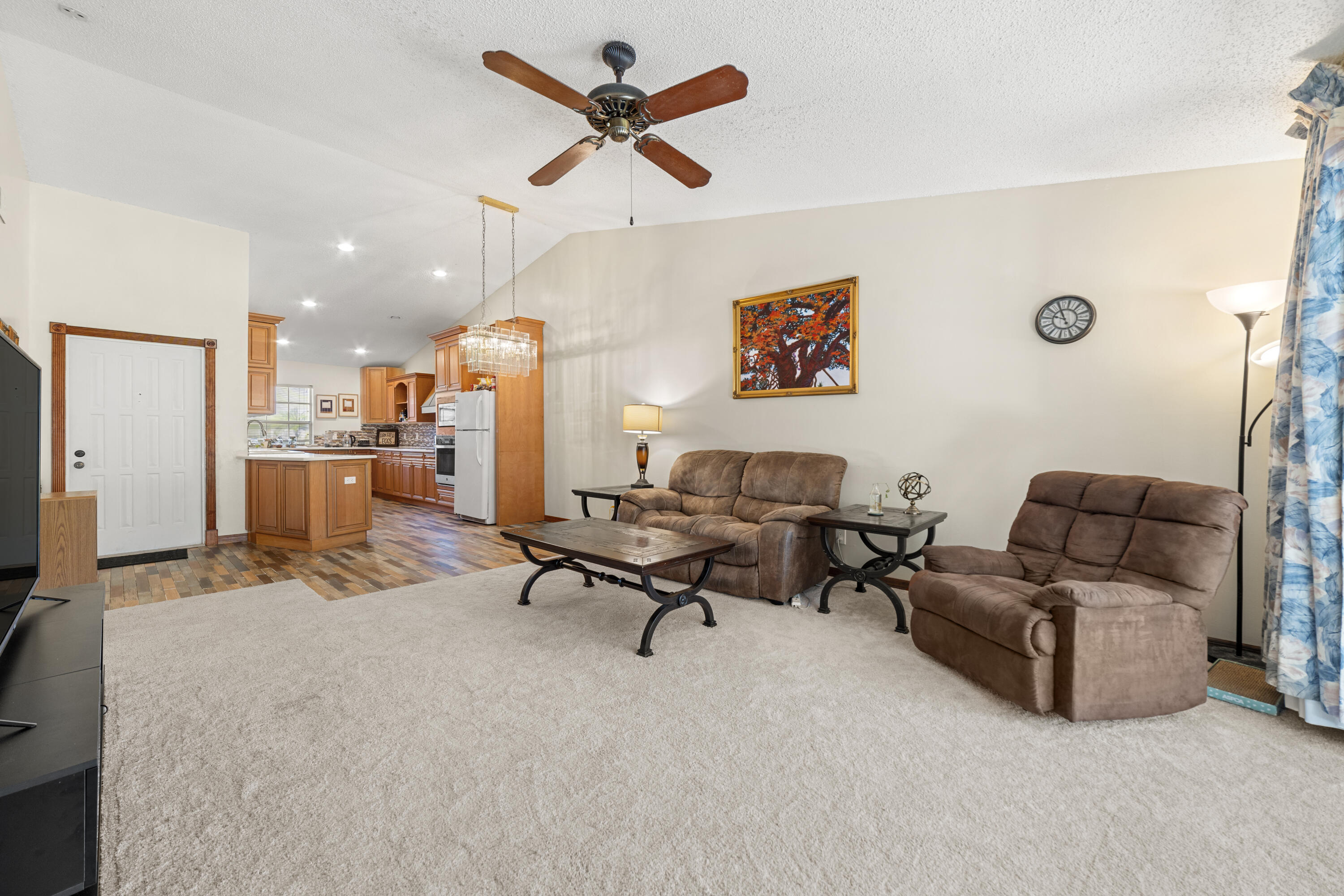 197 Bent Arrow Drive Jupiter, FL 33458 - Photo 5 of 33 a living room with furniture and kitchen view