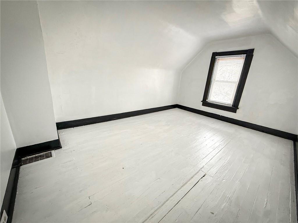 548 West Brady Street Butler, PA 16001 - Photo 19 of 36 a view of a room with wooden floor and window
