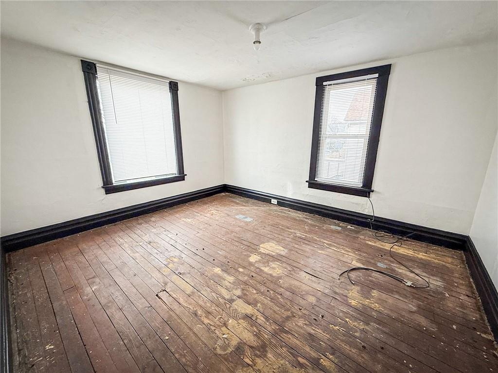 548 West Brady Street Butler, PA 16001 - Photo 21 of 36 a view of an empty room with wooden floor and a window