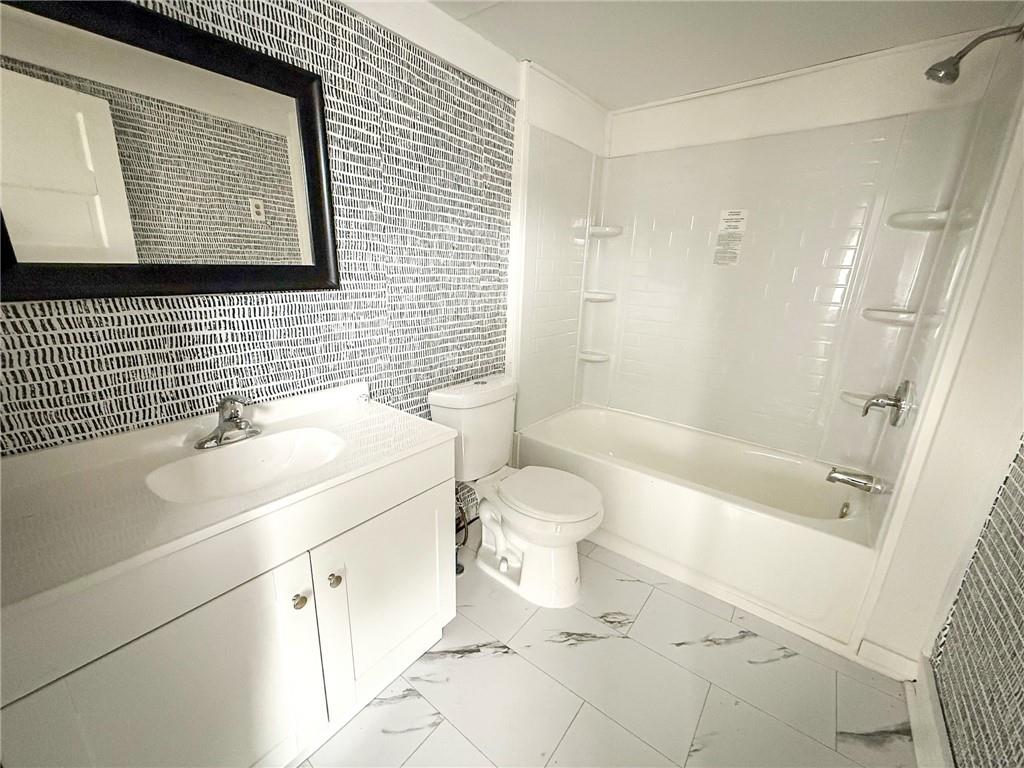 548 West Brady Street Butler, PA 16001 - Photo 25 of 36 a bathroom with a sink toilet and shower