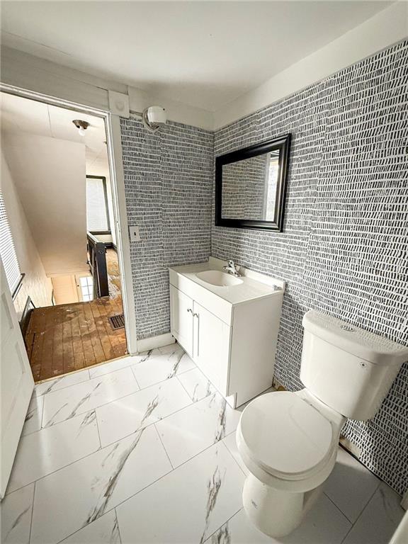 548 West Brady Street Butler, PA 16001 - Photo 26 of 36 a bathroom with a sink a toilet a mirror and shower curtain