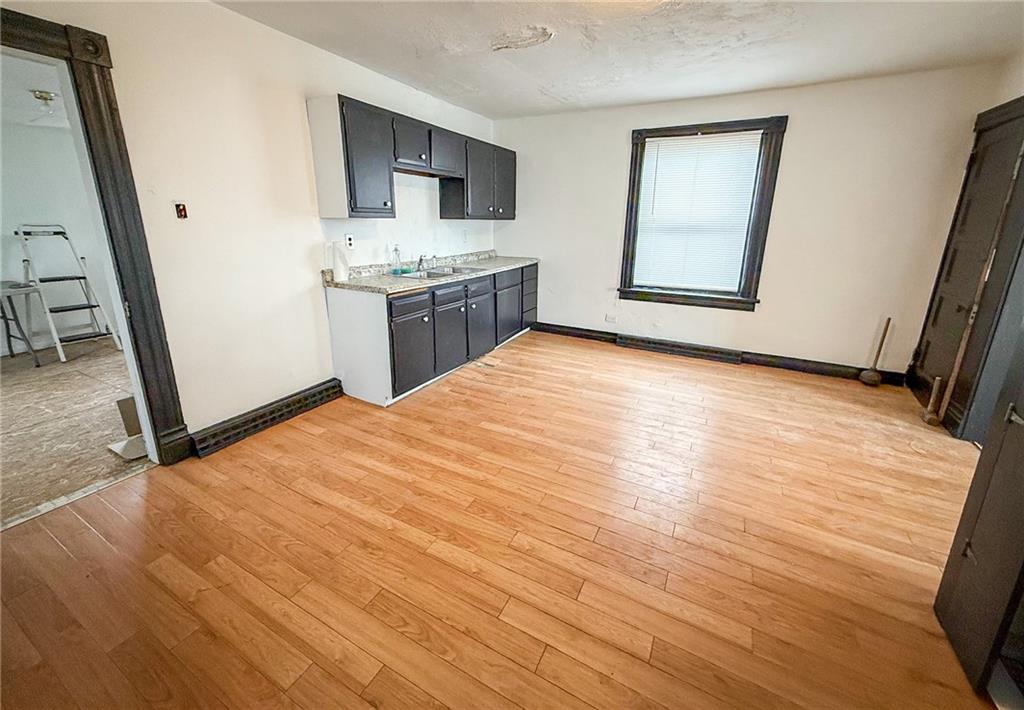 548 West Brady Street Butler, PA 16001 - Photo 10 of 36 a view of a kitchen with a sink and a fireplace