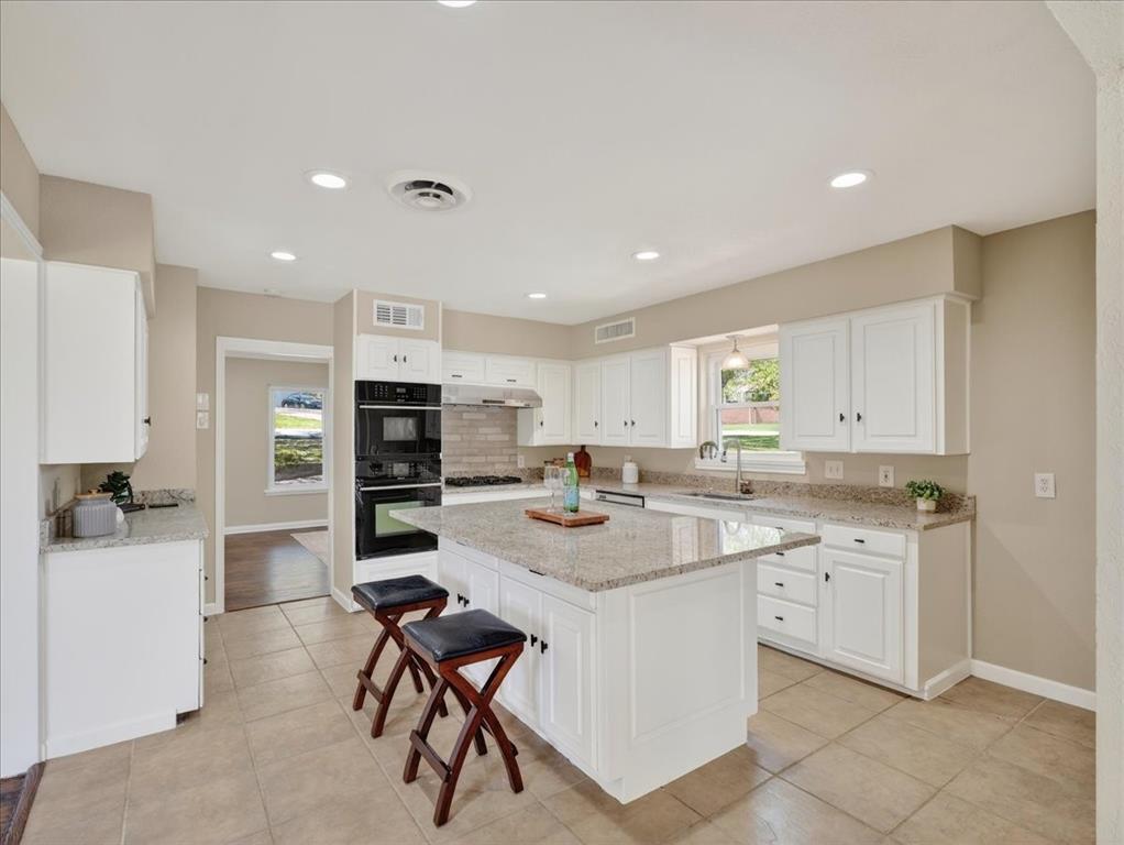 3863 Clayton Road East Fort Worth, TX 76116 - Photo 11 of 39 a kitchen with a sink stainless steel appliances and cabinets