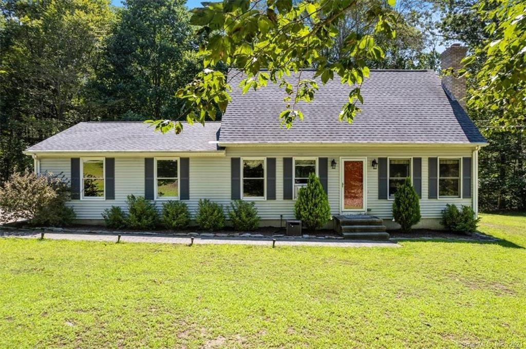 65 Forsyth Road Salem, CT 06420 - Photo 1 of 1 a front view of a house with a garden and yard