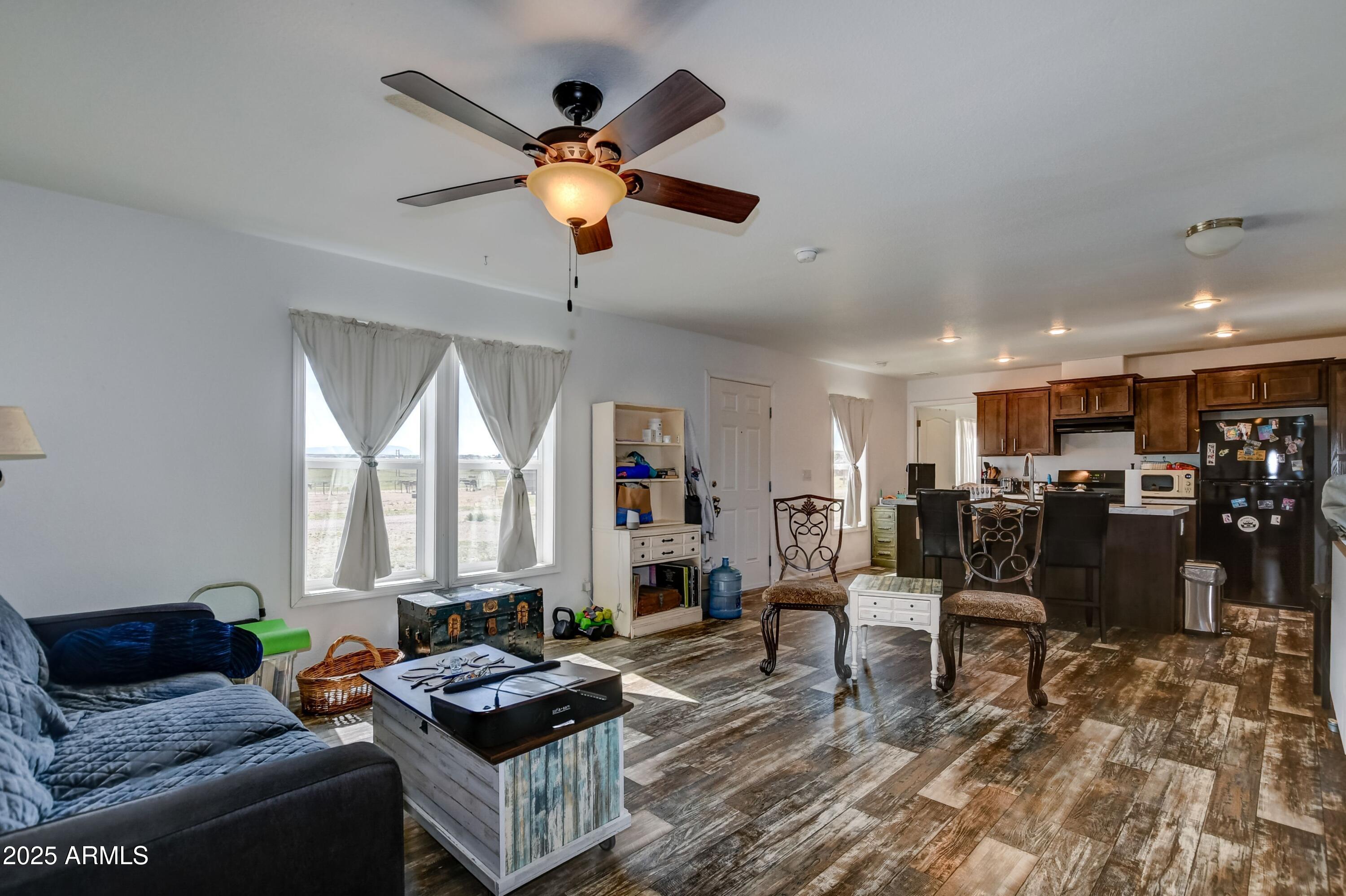 1787 East Perkinsville Road Chino Valley, AZ 86323 - Photo 8 of 13 a living room with furniture and a large window