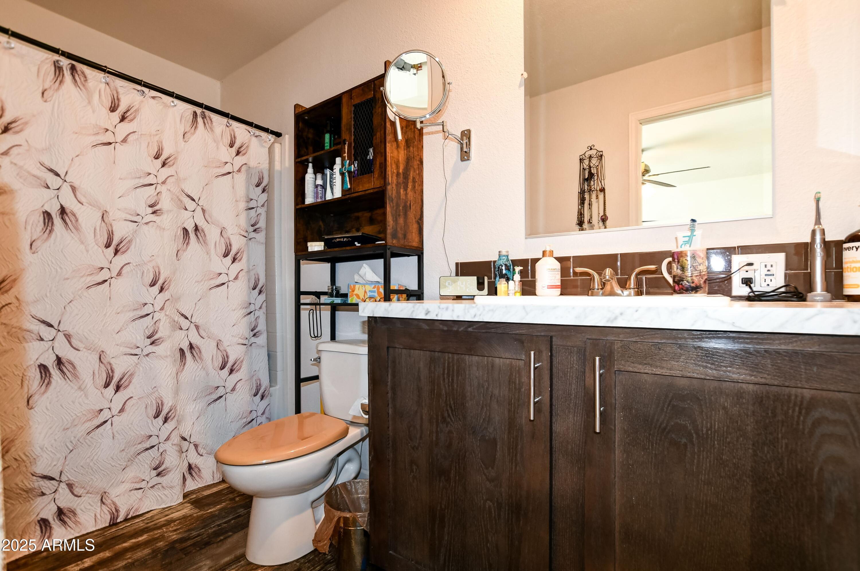 1787 East Perkinsville Road Chino Valley, AZ 86323 - Photo 9 of 13 a bathroom with a sink and a toilet