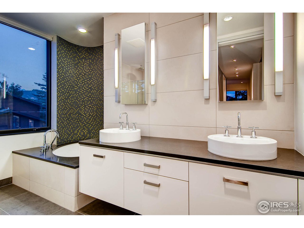 1701 15th Street, Unit 302 Boulder, CO 80302 - Photo 13 of 25 a bathroom with a double vanity sink and mirror
