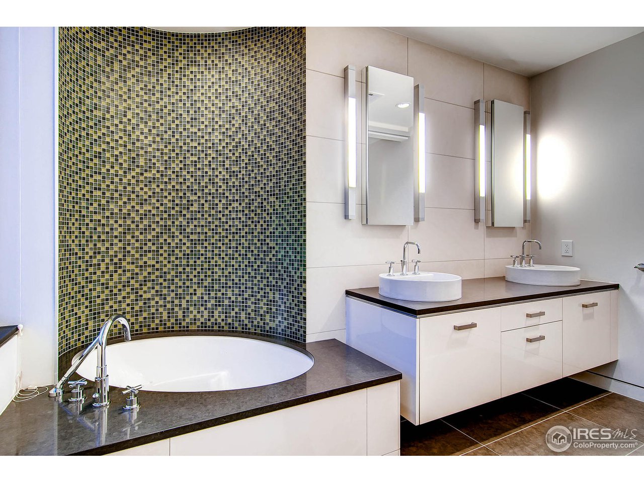 1701 15th Street, Unit 302 Boulder, CO 80302 - Photo 14 of 25 a bathroom with a sink a toilet a mirror and shower