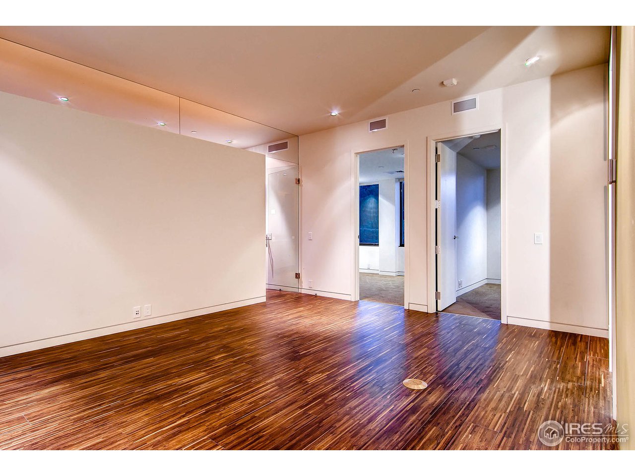 1701 15th Street, Unit 302 Boulder, CO 80302 - Photo 17 of 25 a view of an empty room with wooden floor