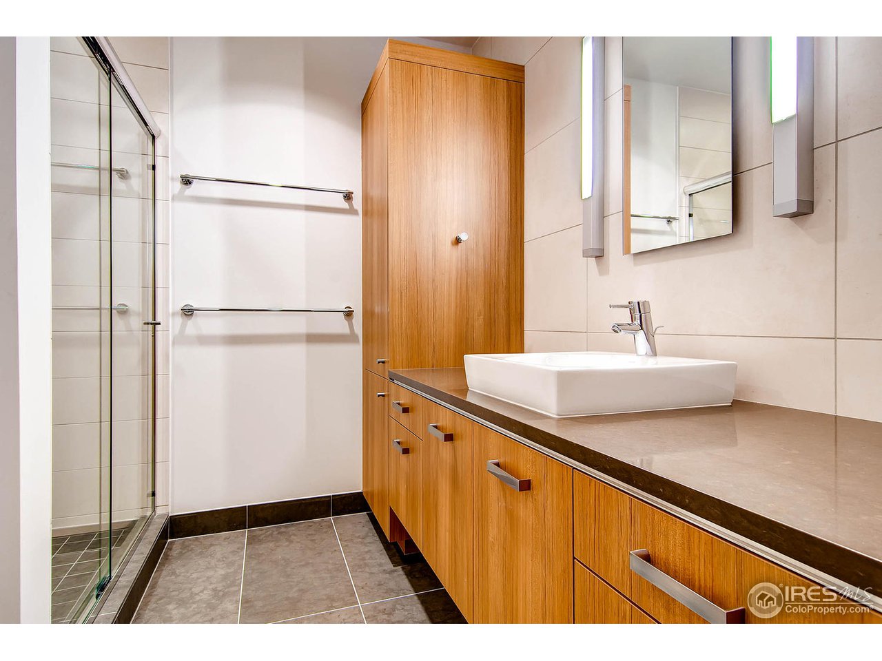 1701 15th Street, Unit 302 Boulder, CO 80302 - Photo 21 of 25 a bathroom with a sink and a mirror