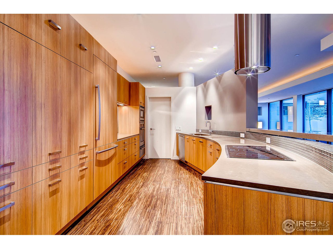 1701 15th Street, Unit 302 Boulder, CO 80302 - Photo 9 of 25 a view of a kitchen with stainless steel appliances a sink and a large window