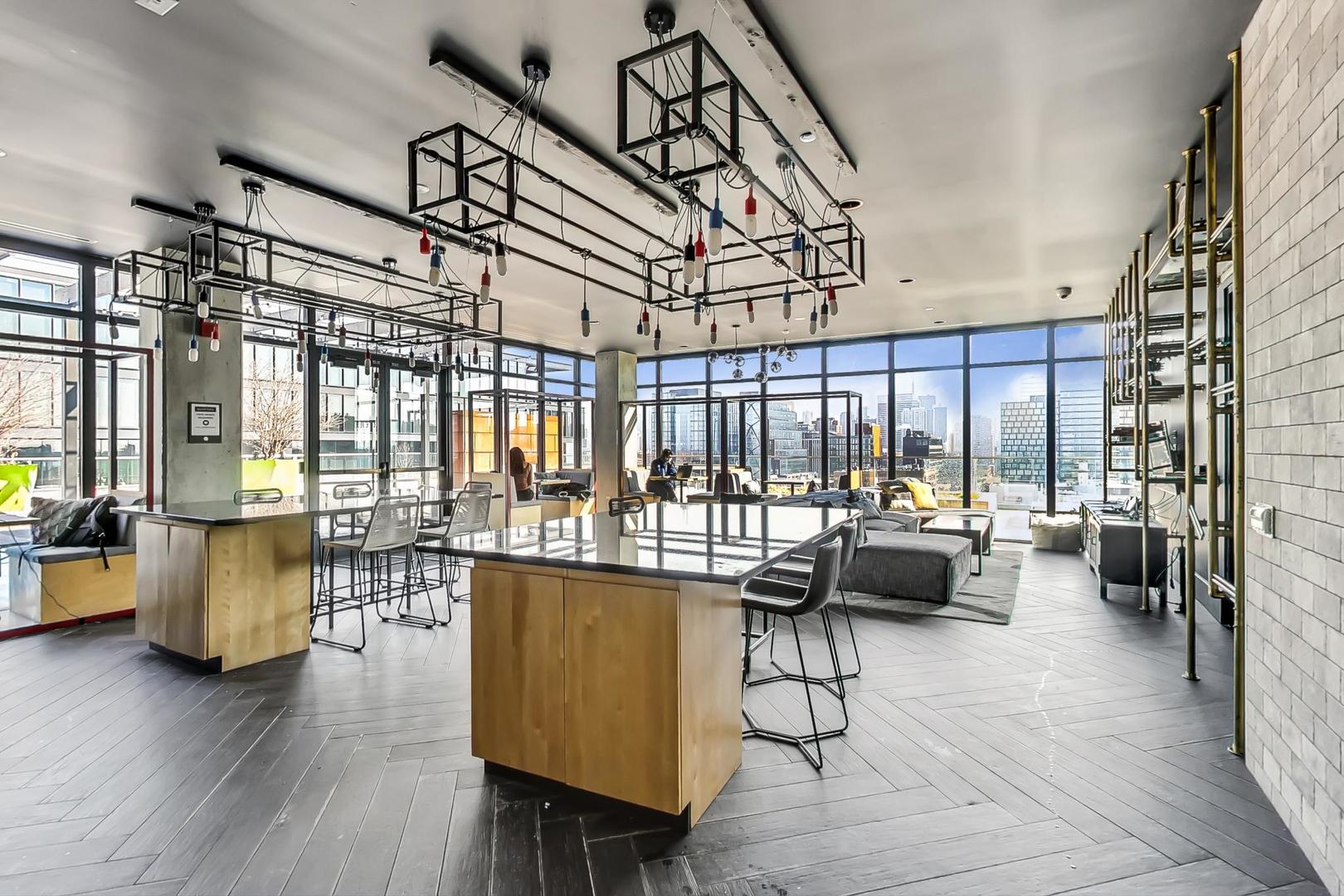 171 North Aberdeen Street, Unit 706 Chicago, IL 60607 - Photo 20 of 20 a living room with furniture and a large window