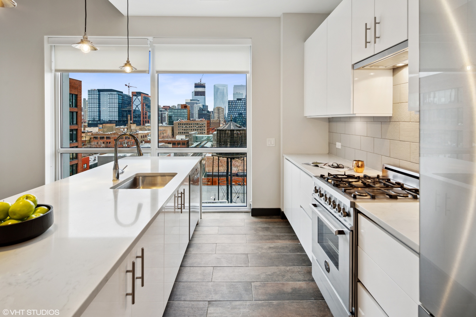 171 North Aberdeen Street, Unit 706 Chicago, IL 60607 - Photo 7 of 20 a kitchen with stove and white cabinets