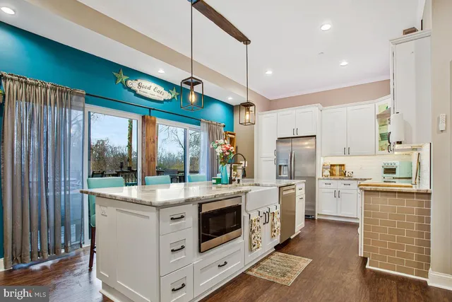 a living room with a flat screen tv and a fireplace