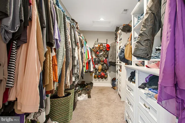 a bedroom with a bed and a television