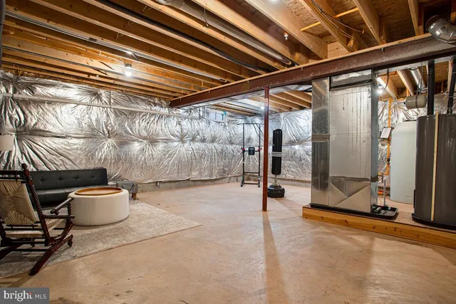 a view of storage and utility room with washer and dryer