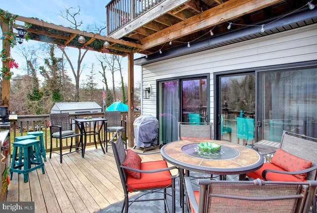 a balcony with furniture and wooden floor