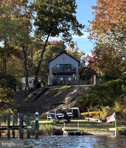 a view of a house with snow on the road
