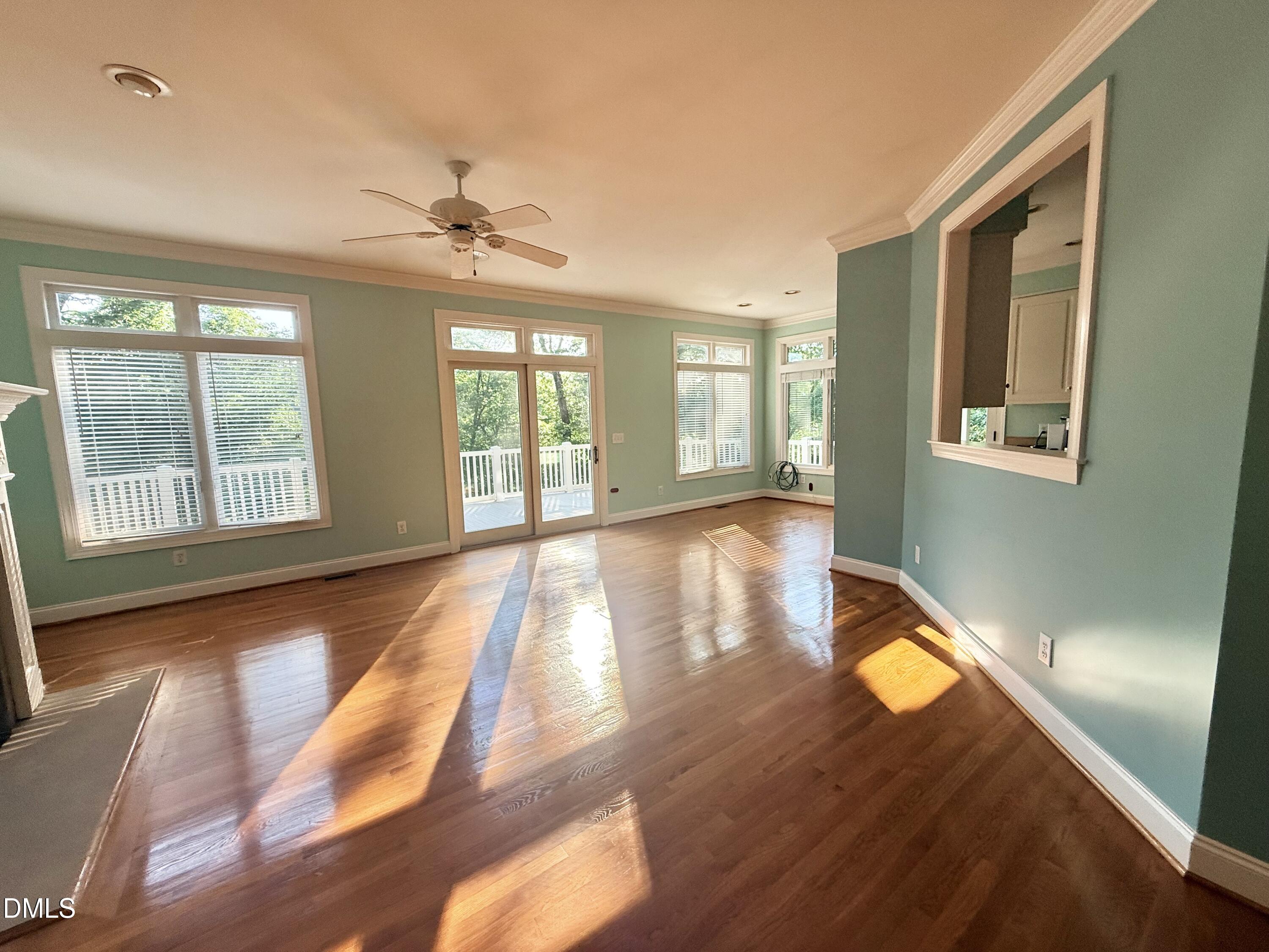 81 Beaver Crossing Road Roxboro, NC 27574 - Photo 11 of 80 a view of an empty room with window and wooden floor