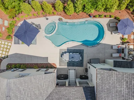 an aerial view of houses with yard