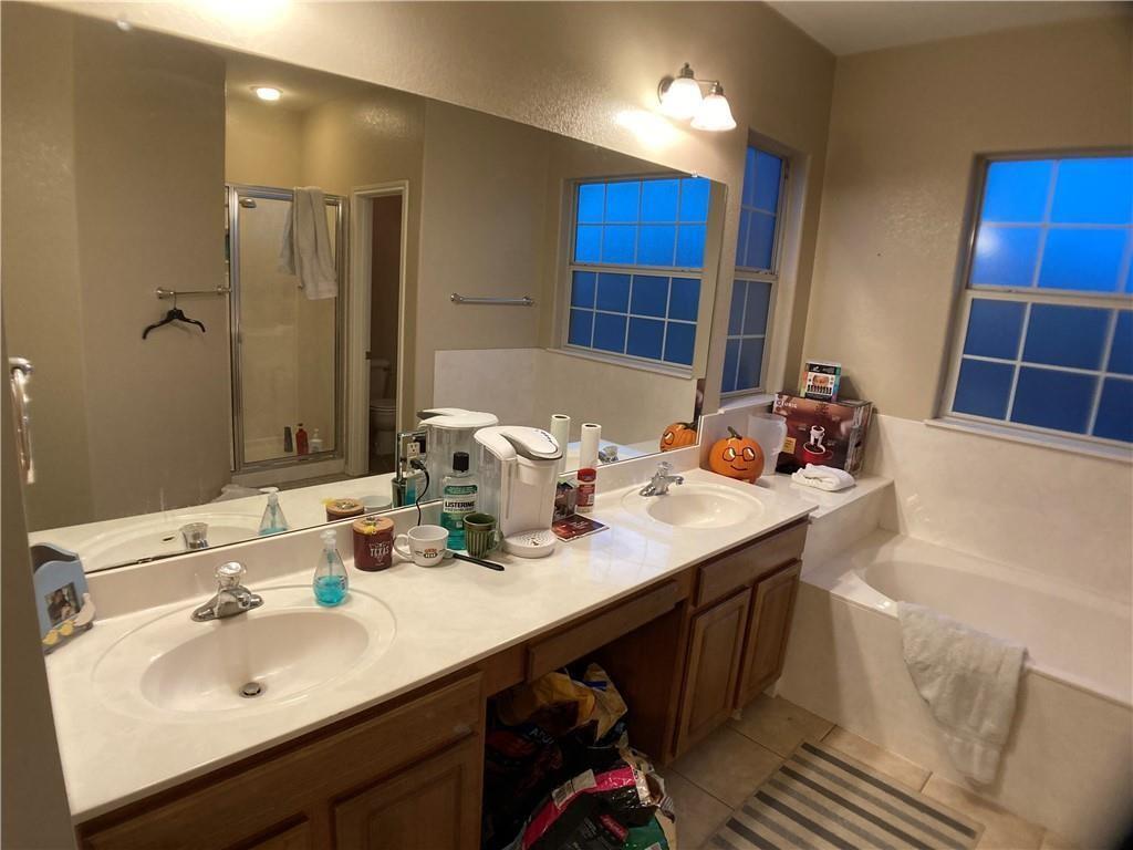 5501 Duval Street, Unit A Austin, TX 78751 - Photo 11 of 23 a bathroom with a sink double vanity and a mirror