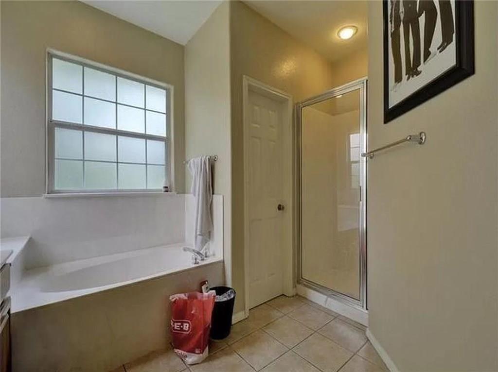 5501 Duval Street, Unit A Austin, TX 78751 - Photo 12 of 23 a bathroom with a tub and shower