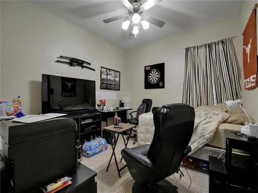 5501 Duval Street, Unit A Austin, TX 78751 - Photo 16 of 23 a living room with furniture and a flat screen tv