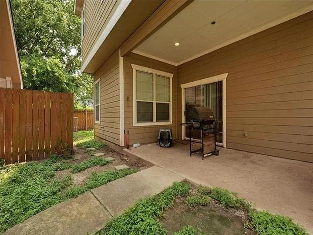 5501 Duval Street, Unit A Austin, TX 78751 - Photo 19 of 23 a view of a backyard with chairs and a large tree