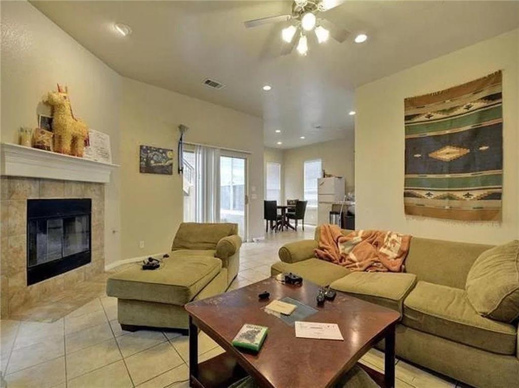 5501 Duval Street, Unit A Austin, TX 78751 - Photo 5 of 23 a living room with furniture and a fireplace
