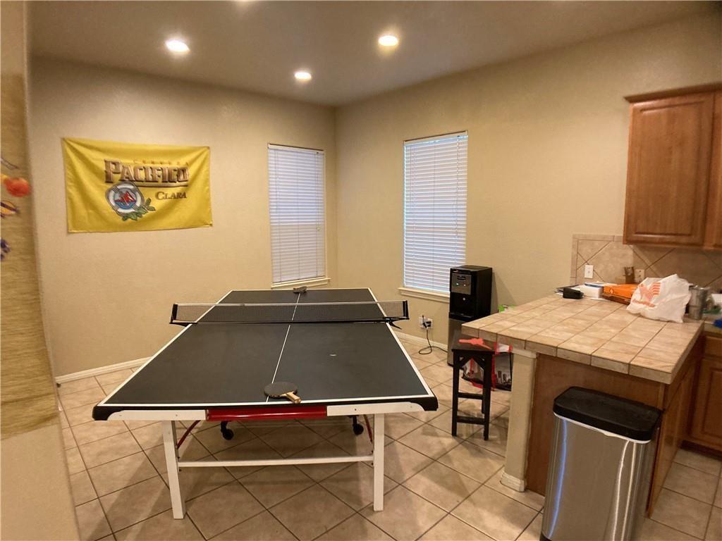 5501 Duval Street, Unit A Austin, TX 78751 - Photo 6 of 23 a room with furniture pool table and flat screen tv