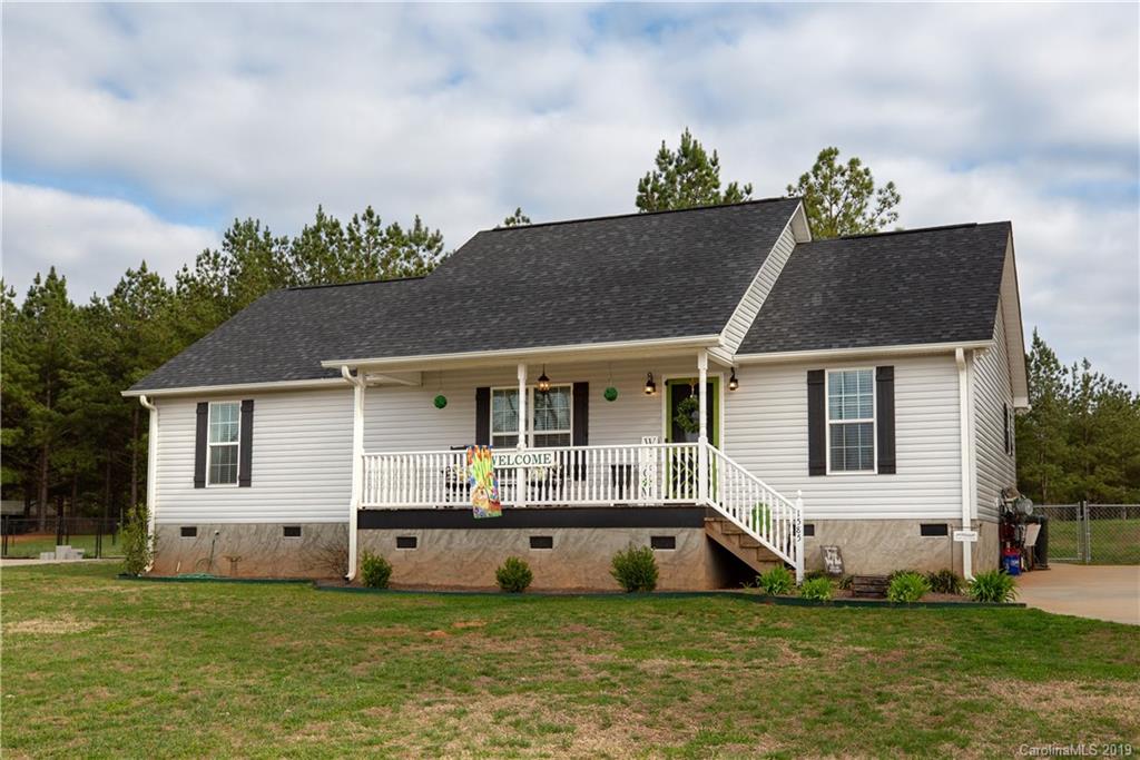 1585 State Rd S-46-323 York, SC 29745 - Photo 23 of 25 a front view of a house with a garden