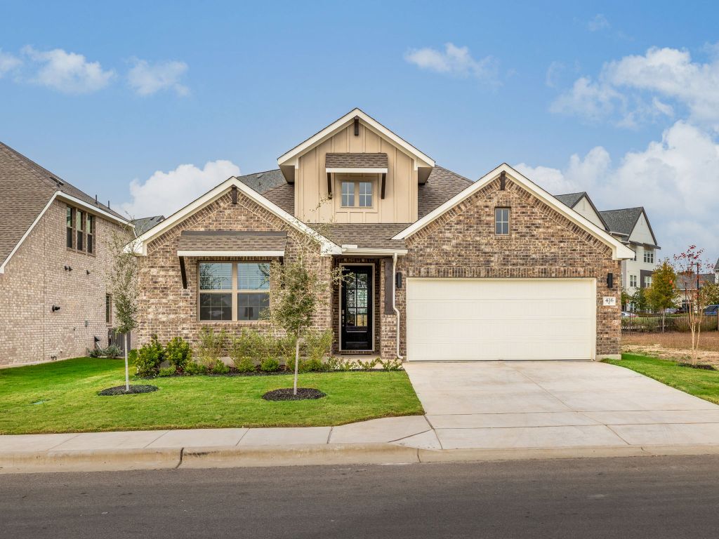 416 Ridgewell Loop Georgetown, TX 78633 - Photo 1 of 19 a front view of a house with a yard and garage