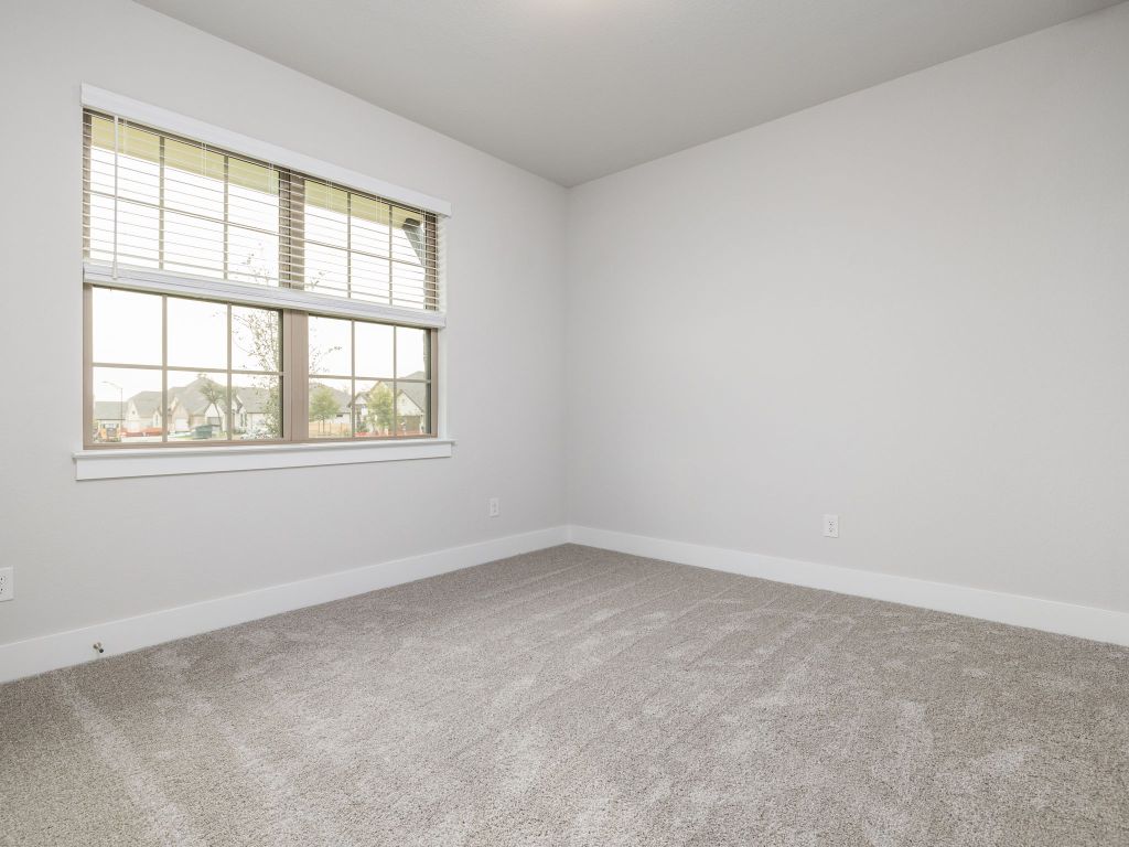 416 Ridgewell Loop Georgetown, TX 78633 - Photo 13 of 19 an empty room with a window