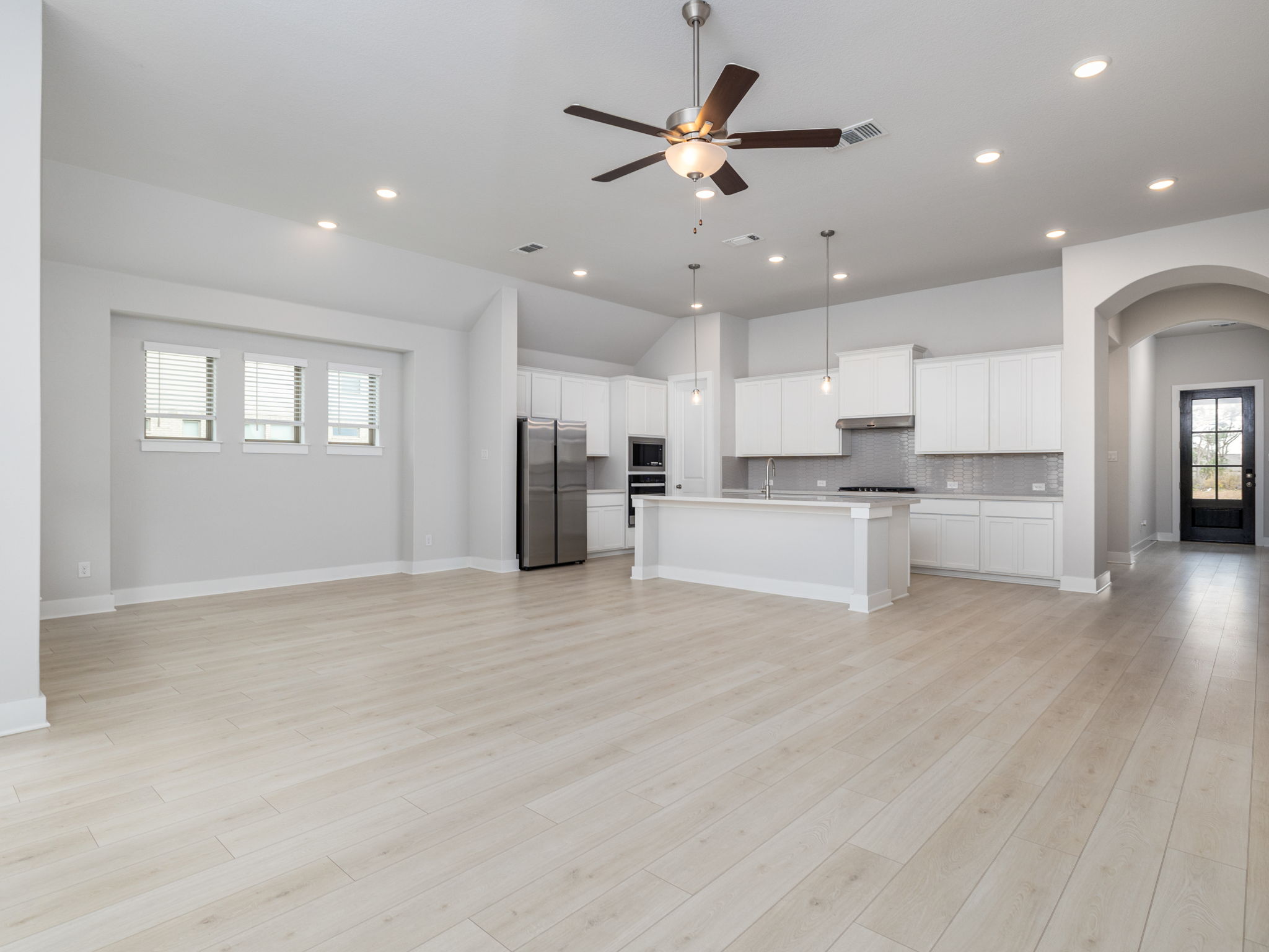 416 Ridgewell Loop Georgetown, TX 78633 - Photo 2 of 19 a view of kitchen with wooden floor and window